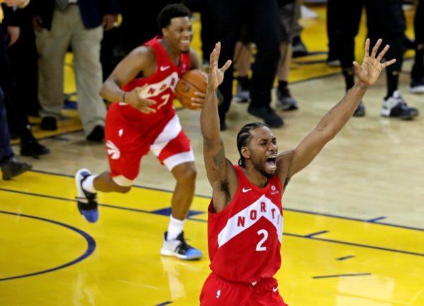 Raptors forward Kawhi Leonard (2) and Toronto Raptors guard Kyle Lowry (7) celebrate winning the NBA Championship over the Golden State Warriors against game six of the 2019 NBA Finals at Oracle Arena on June 13, 2019. (Sergio Estrada-USA TODAY Sports/The Canadian Press)