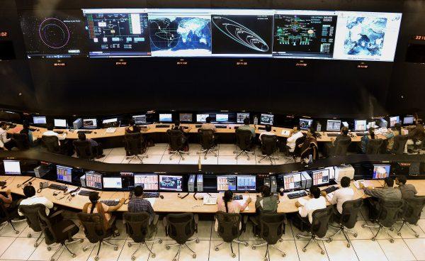 Indian scientists and engineers of Indian Space Research Organization (ISRO) monitor the Mars Orbiter Mission (MOM) at the tracking center, in Bangalore on November 27, 2013. (Manjunath Kiran/AFP/Getty Images)