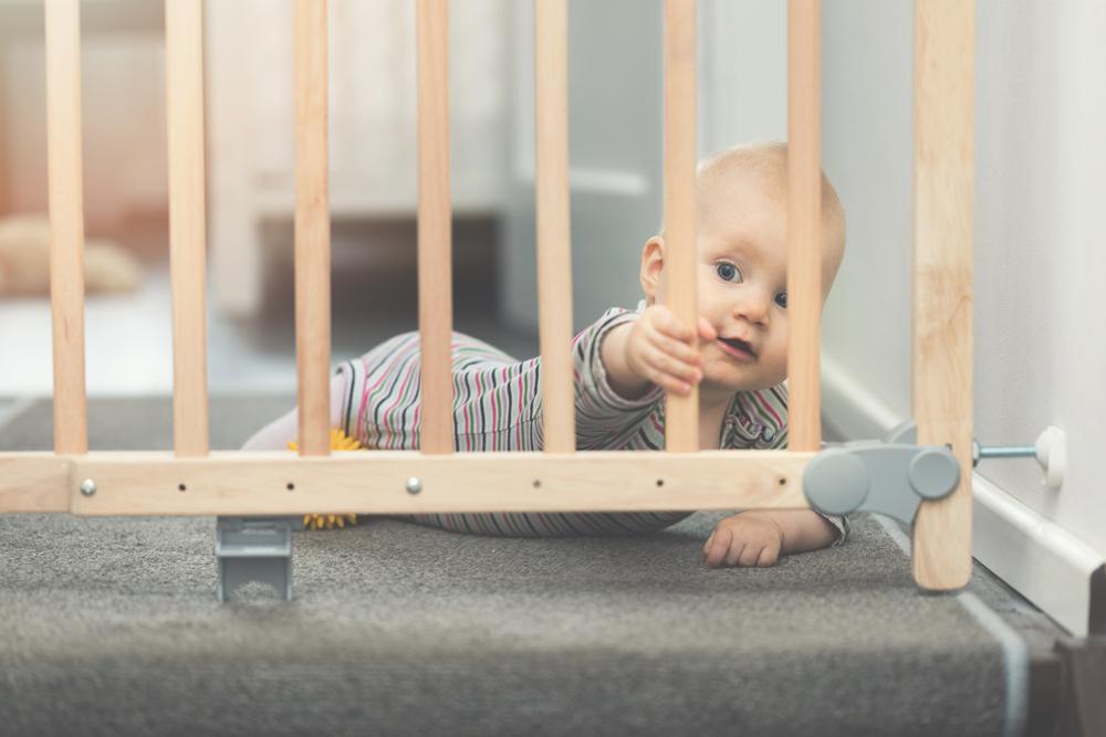 "The only thing I can assume is he’s watching my baby, my wife, or myself," Jerome worried (Illustration - Shutterstock | <a href="https://www.shutterstock.com/image-photo/child-playing-behind-safety-gates-front-676646413?studio=1">ronstik</a>)