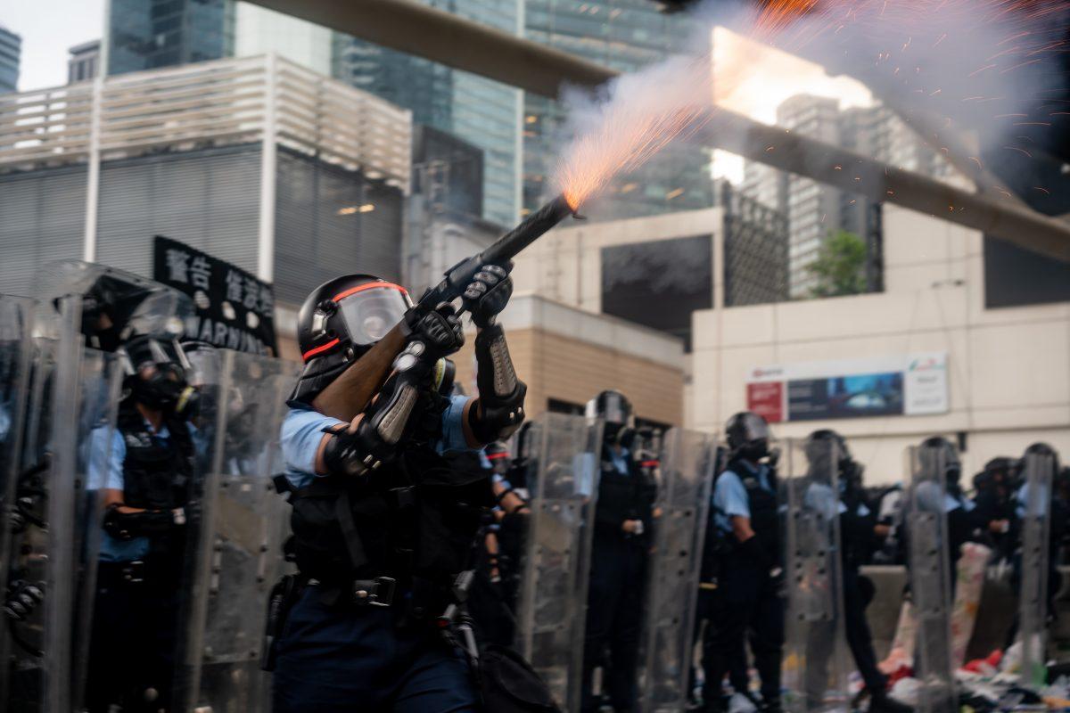 A police officer fire teargas during a protest in Hong Kong, on June 12, 2019. (Anthony Kwan/Getty Images)