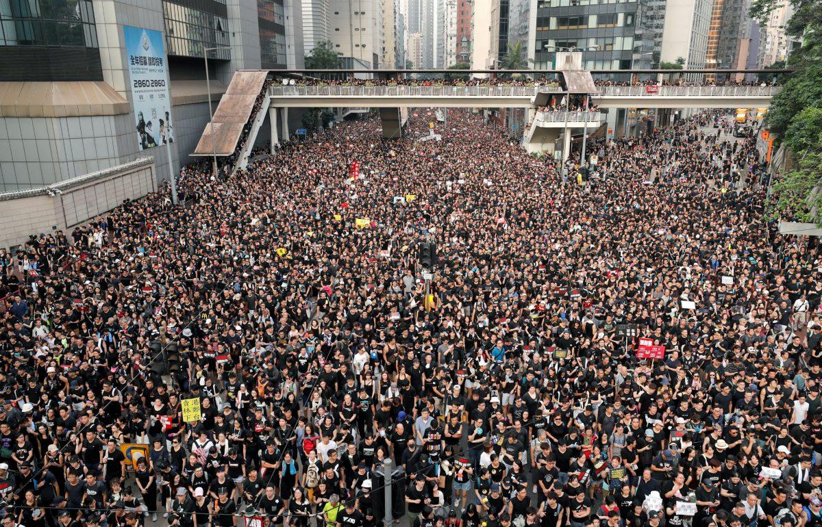Protesters attend a demonstration demanding Hong Kong's leaders to step down and withdraw the extradition bill, in Hong Kong, on June 16, 2019. (Tyrone Siu/Reuters)
