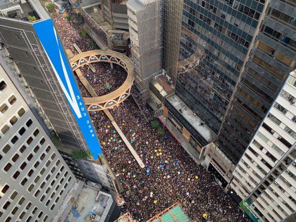 Birds-eye-view of the Hong Kong 'Withdraw Evil Extradition Bill' march as it passes through Causeway Bay on June 16, 2019. (Li Yi/The Epoch Times)