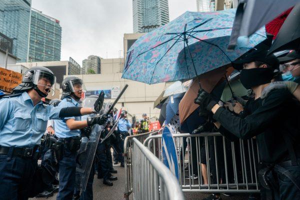 Police clash with protesters during a rally against a controversial extradition law proposal outside the government headquarters in Hong Kong on June 12, 2019. (Dale De La Rey/AFP/Getty Images)