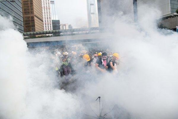 Protesters walk in a cloud of tear gas during a protest against a proposed extradition law on June 12, 2019, in Hong Kong, Hong Kong. (Billy H.C. Kwok/Getty Images)