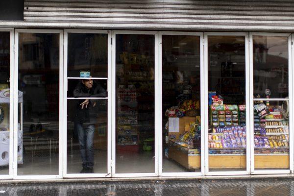 A man stands inside a store without power during a blackout, in Buenos Aires, Argentina on June 16, 2019. (Tomas F. Cuesta/Photo via AP)