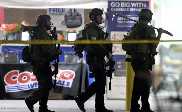 Heavily armed police officers exit the Costco following a shooting inside the wholesale warehouse in Corona, Calif., on June 14, 2019. (Will Lester/Inland Valley Daily Bulletin/SCNG via AP)