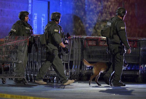Heavily armed police officers exit the Corona Costco following a shooting inside the wholesale warehouse in Corona, Calif., on June 14, 2019. (Will Lester/Inland Valley Daily Bulletin/SCNG via AP)