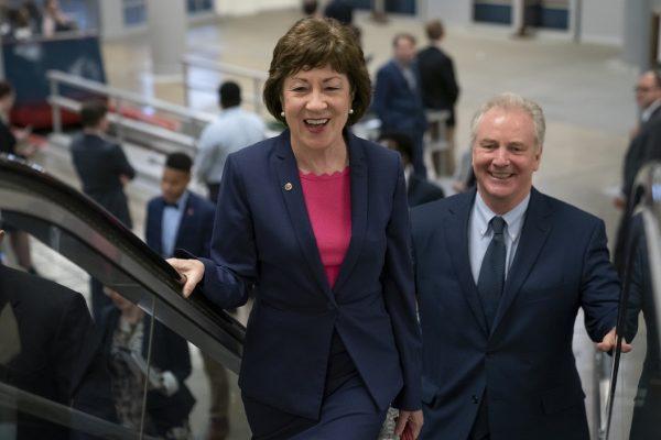 Republican Sen. Susan Collins of Maine, joined by Sen. Tim Kaine (D-Va.) right, arrives at the Capitol to extend her perfect Senate voting record to 7,000, as she prepares for a 2020 campaign in Washington on June 18, 2019. (J. Scott Applewhite/AP Photo)