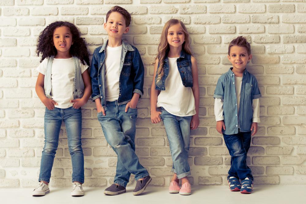 Jeans took off and evolved to become America's favorite item of clothing (©Shutterstock | <a href="https://www.shutterstock.com/image-photo/full-length-portrait-cute-little-kids-428585305?src=S9zuoNI_vn8dZI_h9O4Ucg-1-99&studio=1">George Rudy</a>)