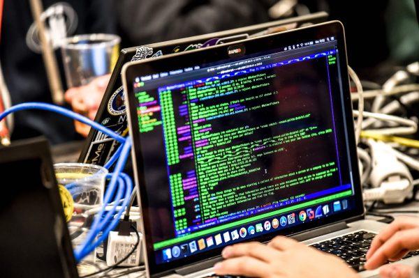 A person delivers a computer payload while working on a laptop during the 11th International Cybersecurity Forum in Lille, France, on Jan. 22, 2019. (Philippe Huguen/AFP/Getty Images)