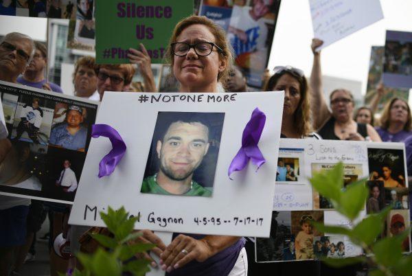 Christine Gagnon of Southington, Conn. protests with other family and friends who have lost loved ones to OxyContin and opioid overdoses at Purdue Pharma LLP headquarters in Stamford, Conn., on Aug. 17, 2018. (Jessica Hill/AP Photo)