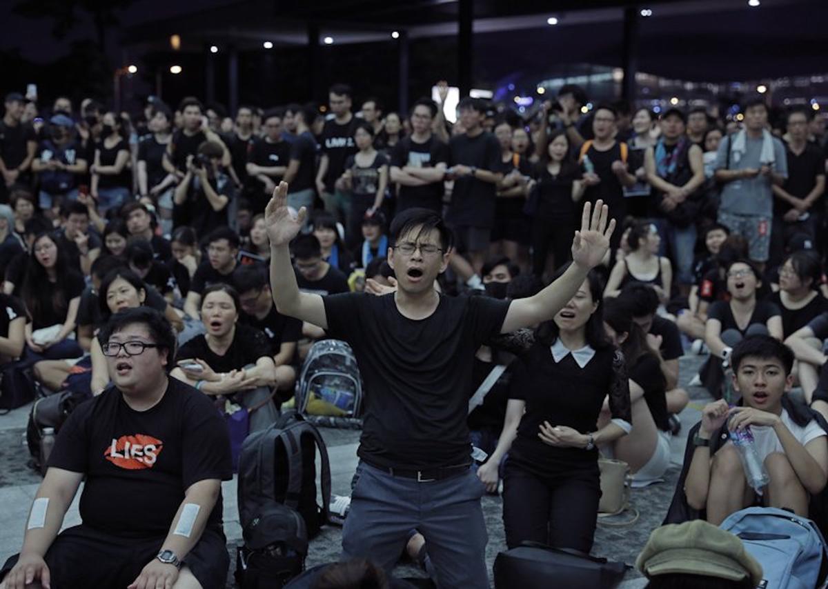 Protesters sing after a march against an extradition bill outside Legislative Council in Hong Kong on June 16, 2019. Hong Kong residents on Sunday continued their massive protest over an unpopular extradition bill that has highlighted the territory's apprehension about relations with mainland China, a week after the crisis brought as many as 1 million into the streets. (Vincent Yu/AP)