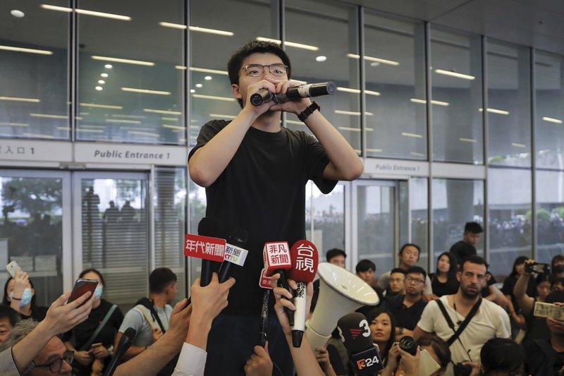 Pro-democracy activist Joshua Wong speaks to protesters near the Legislative Council in Hong Kong on  June 17, 2019. Wong, a leading figure in Hong Kong's 2014 Umbrella Movement demonstrations, was released from prison on Monday and vowed to soon join the latest round of protests. (Kin Cheung/AP)