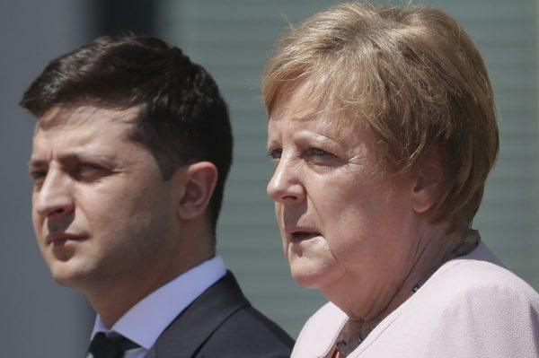 German Chancellor Angela Merkel welcomes Ukraine's President Volodymyr Zelenskiy with military honors for a meeting at the chancellery in Berlin on June 18, 2019. (Michael Sohn/AP Photo)