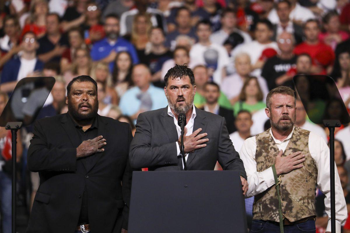 Combat veterans lead the Pledge of Allegiance at President Donald Trump’s 2020 re-election event in Orlando, Fla., on June 18, 2019. (Charlotte Cuthbertson/The Epoch Times)