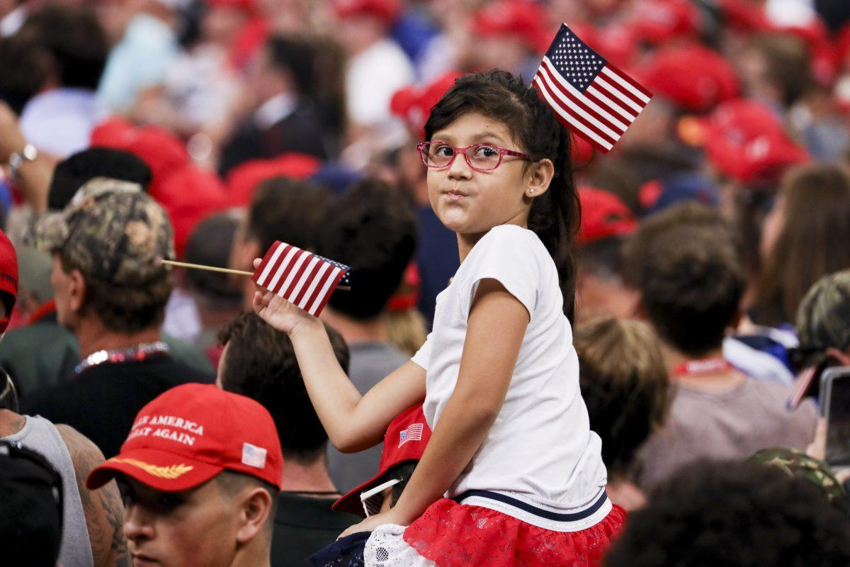 Audience members at President Donald Trump’s 2020 re-election event in Orlando, Fla., on June 18, 2019. (Charlotte Cuthbertson/The Epoch Times)