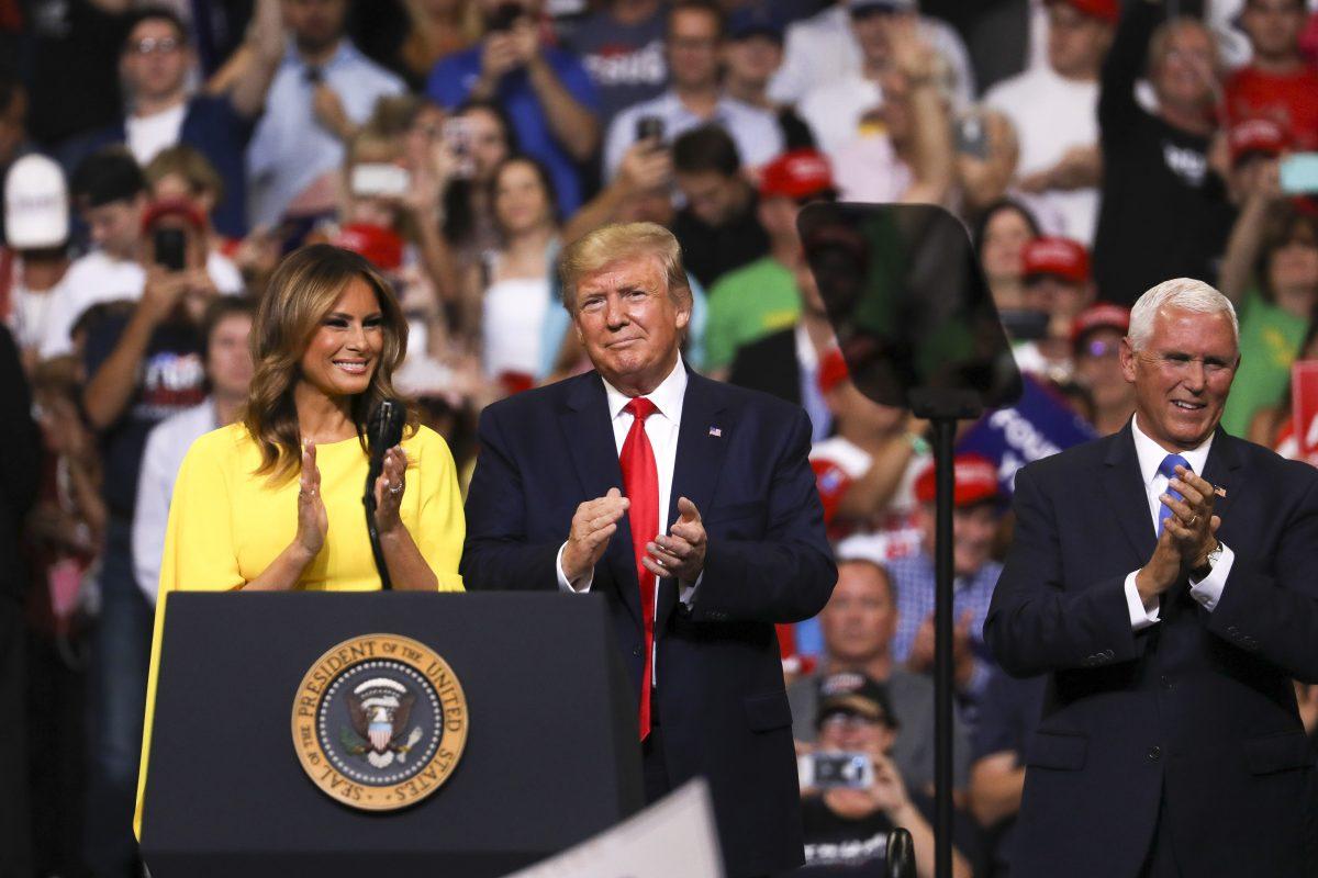First Lady Melania Trump, President Donald Trump, and Vice President Mike Pence at Trump’s 2020 re-election event in Orlando, Fla., on June 18, 2019. (Charlotte Cuthbertson/The Epoch Times)