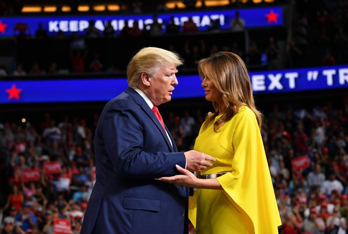 US President Donald Trump greets First Lady Melania Trump as he takes the stage for the official launch of the Trump 2020 campaign at the Amway Center in Orlando, Florida on June 18, 2019. - Trump kicks off his reelection campaign at what promised to be a rollicking evening rally in Orlando. (MANDEL NGAN/AFP/Getty Images)