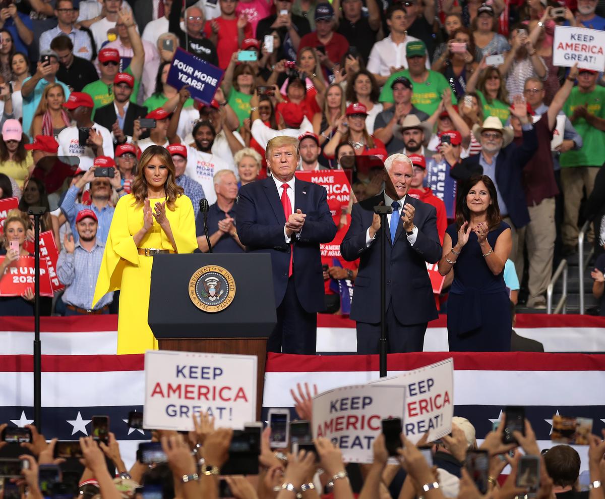 President Donald Trump, First Lady Melania Trump, Vice President Mike Pence, and Second Lady Karen Pence stand on stage together as President Trump prepares to announce his candidacy for a second presidential term at the Amway Center in Orlando, Florida, on June 18, 2019. President Trump is set to run against a wide open Democratic field of candidates. (Joe Raedle/Getty Images)