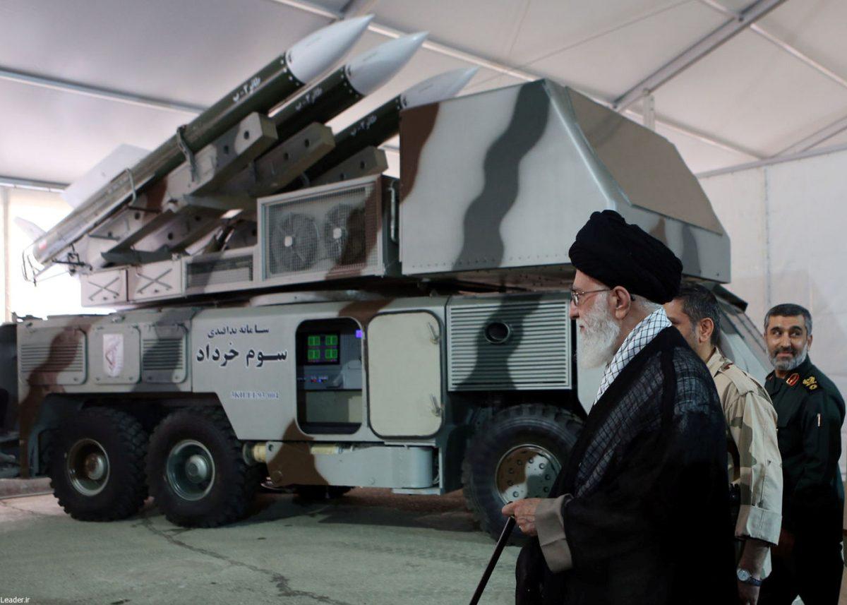 Iran's Supreme Leader Ayatollah Ali Khamenei is seen near a "3 Khordad" system which is said to had been used to shoot down a U.S. military drone, according to the state-sponsored news agency Fars, in this undated handout picture. (Fars news/Handout via Reuters)
