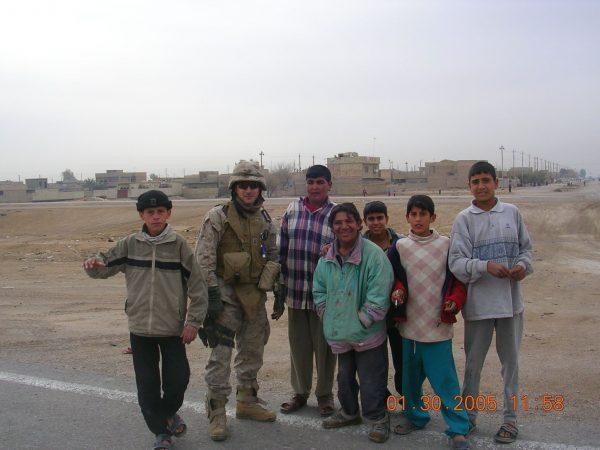 Buzz Bryan with Iraqi children. (Courtesy of Nick Benas)