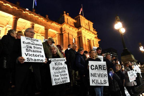 Pro-life demonstrators gather outside the Victorian State Parliament, opposing the progressive government's euthanasia laws in Melbourne on June 18, 2019. (James Ross/AAP Image via AP)