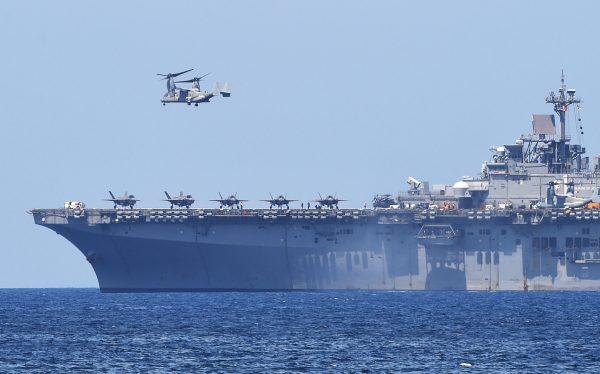 A U.S. V-22 Osprey takes off from the USS Wasp, U.S. Navy multipurpose amphibious assault ship, during the amphibious landing exercises as part of the annual joint U.S.-Philippines military exercise on the shores of San Antonio town, facing the South China Sea, Zambales Province on April 11, 2019. (Ted Aljibe/AFP/Getty Images)