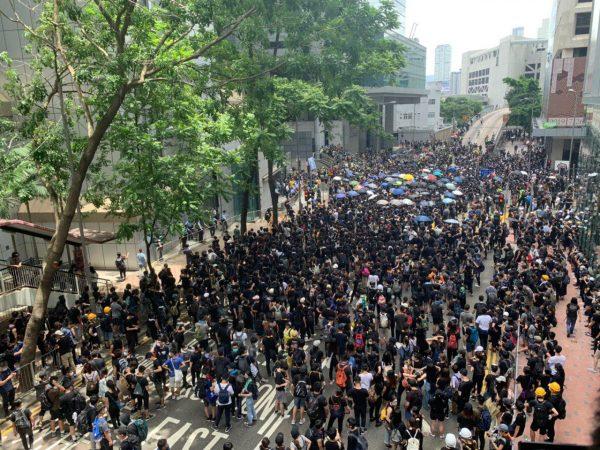 Protesters occupy Arsenal Street outside of the Hong Kong Police Headquarters in Wan Chai on June 21, 2019. (Li Yi/The Epoch Times)