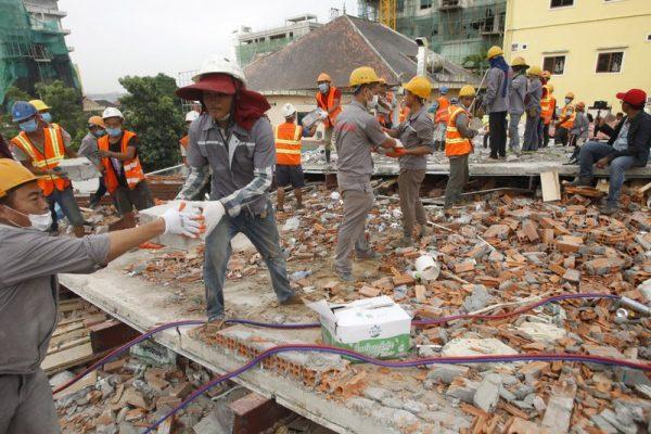 Rescue workers remove the rubble of a collapsed building in Preah Sihanouk province, Cambodia on June 22, 2019. (Heng Sinith/Photo via AP)