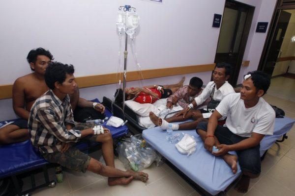 Victims from the site of a collapsed building sit in a hospital in Preah Sihanouk province, Cambodia on June 22, 2019. (Heng Sinith/Photo via AP)