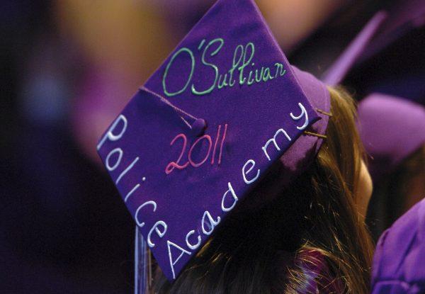 Tara O'Sullivan decorated her mortar board with her police academy plans at College Park High School's commencement ceremony in Concord, Calif. on June 6, 2011. (Karl Mondon/Bay Area News Group via AP, File)