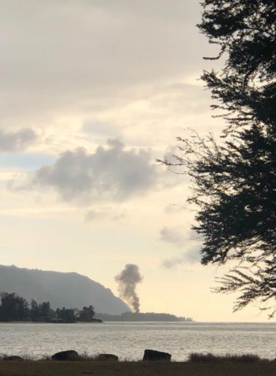 A plume of smoke rises after an airplane crash in Haleiwa, Hawaii on June 21, 2019. (LuckyWeLive.com via Reuters)