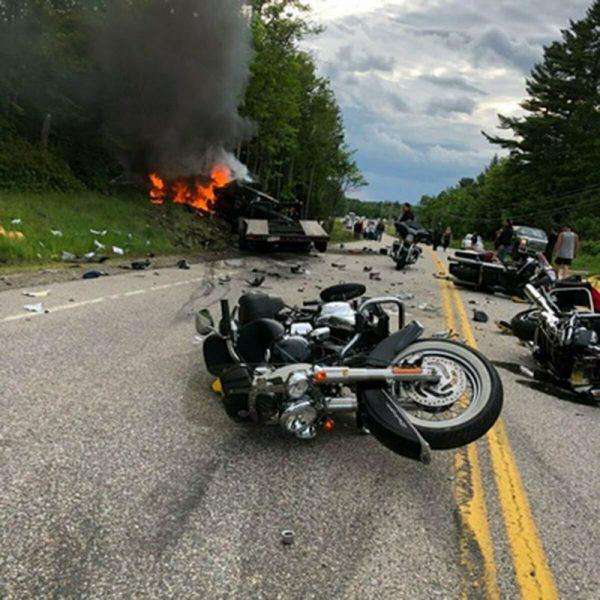 This photo provided by Miranda Thompson shows the scene where several motorcycles and a pickup truck collided on a rural, two-lane highway on June 21, 2019 in Randolph, N.H. (Miranda Thompson via AP)