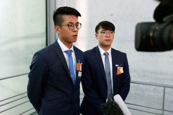 Ray Wong Toi Yeung (L) and Alan Li Tung Sing, two rights activists from Hong Kong who received refugee status in Germany, speak to journalists as they arrive for a Berlin event organised by the Greens to mark the 30th anniversary of the 1989 Tiananmen crackdown in Beijing on June 4, 2019. (ODD ANDERSEN/AFP/Getty Images)