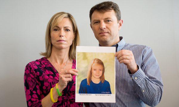 Parents of missing girl Madeleine McCann, Kate (L) and Gerry McCann (R) pose with an artist's impression of how their daughter might look now at the age of nine ahead of a press conference in central London on May 2, 2012. (Leon Neal/AFP/GettyImages)