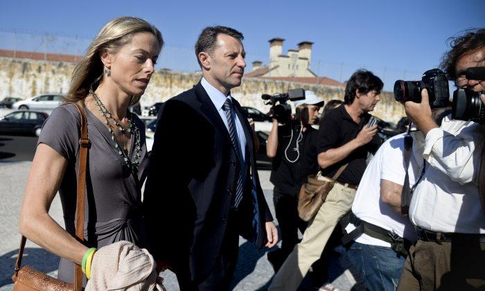 Kate McCann (L) and her husband Gerry McCann (C), parents of missing British girl Madeleine McCann, arrive to the court house in Lisbon on June 16, 2014. (PATRICIA DE MELO MOREIRA/AFP/Getty Images)