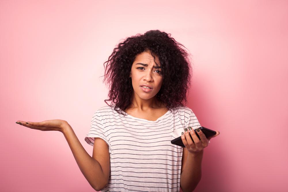 Don't give up yet. You're almost there! (Illustration - Shutterstock | <a href="https://www.shutterstock.com/image-photo/young-woman-mobile-phone-confused-isolated-785597788?studio=1">Paranamir</a>)