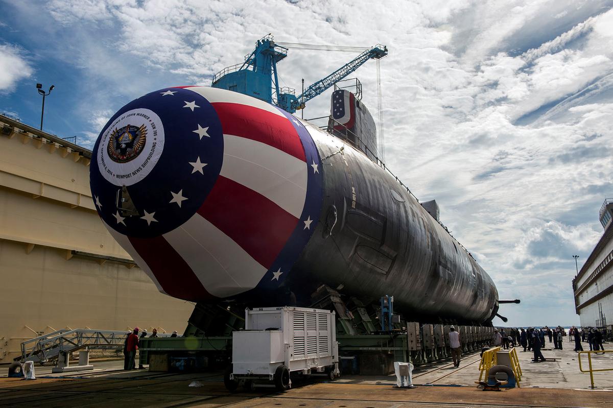 The Virginia-class attack submarine Pre-commissioning Unit (PCU) John Warner (SSN 785) is moved to Newport News Shipbuilding's floating dry dock in preparation for the September 6 christening in Newport News, Virginia, U.S. on Aug. 31, 2014. (U.S. Navy/John Whalen/Huntington Ingalls Industries/Handout via Reuters)