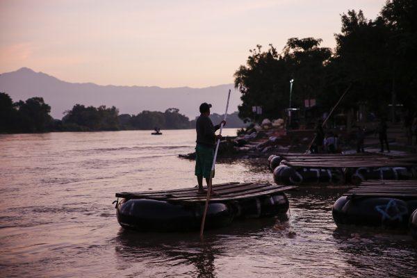 A tube rafter gets ready for a day of ferrying people and goods across the Suchiate River between Tecun Uman, Guatemala, and Hidalgo, Mexico, on June 26, 2019. (Charlotte Cuthbertson/The Epoch Times)