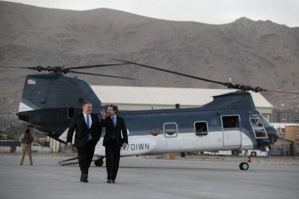 Secretary of State Mike Pompeo, left, walks from a helicopter with U.S. Ambassador to Afghanistan John Bass in Kabul, Afghanistan on June 25, 2019. (Jacquelyn Martin/Pool via AP)