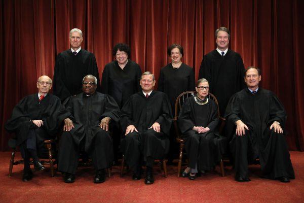 (Front L–R) U.S. Supreme Court justices Stephen Breyer, Clarence Thomas, John Roberts, Ruth Bader Ginsburg, Samuel Alito, (Back L–R) Neil Gorsuch, Sonia Sotomayor, Elena Kagan, and Brett Kavanaugh at the Supreme Court building on Nov. 30, 2018. (Chip Somodevilla/Getty Images)