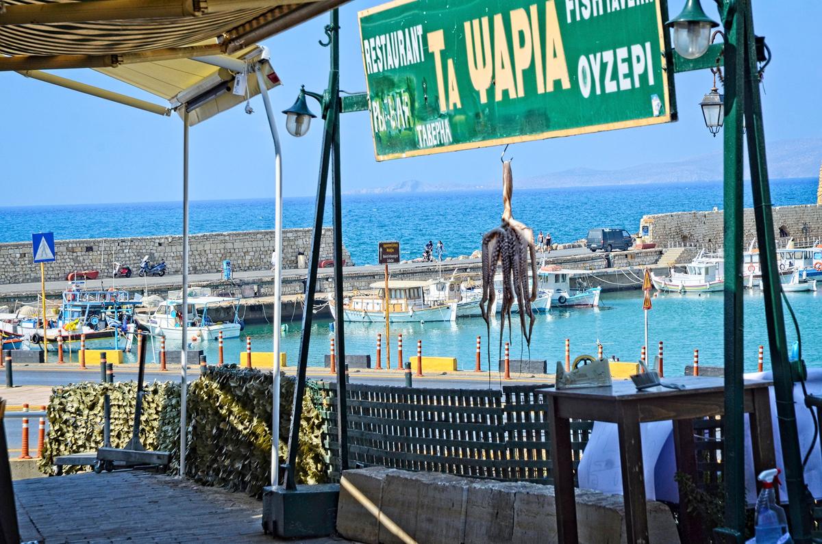 A fish taverna overlooks the Old Venetian Harbor. (Phil Butler)