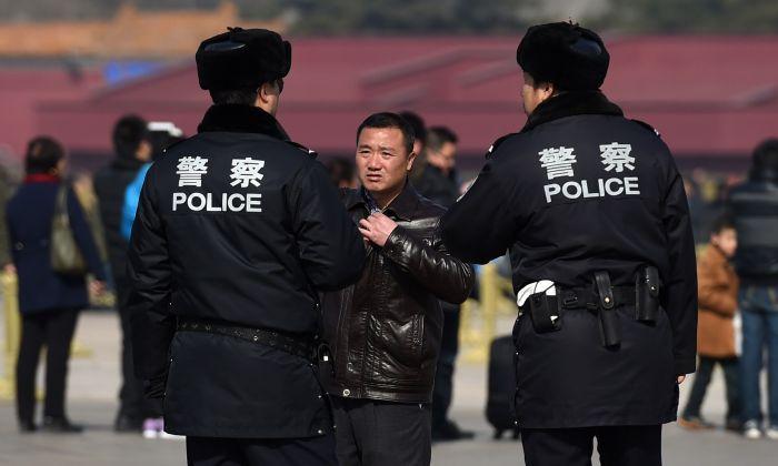 Chinese Police Step Up Phone Checks, Using Surveillance Apps