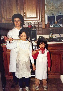 Anna Francese Gass with her sister and mother in the kitchen, tasting the brodo di mamma, in 1989. (Courtesy of Anna Francese Gass)