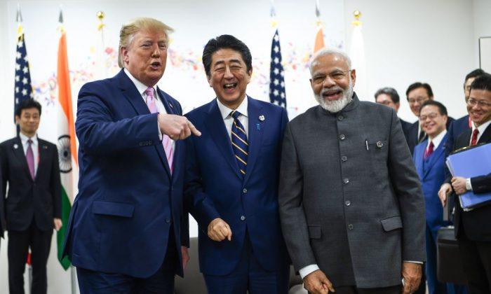 (L-R) U.S. President Donald Trump, Japanese Prime Minister Shinzo Abe, and India's Prime Minister Narendra Modi attend a meeting during the G20 Osaka Summit in Osaka on June 28, 2019. (Brendan Smialowski/AFP/Getty Images)