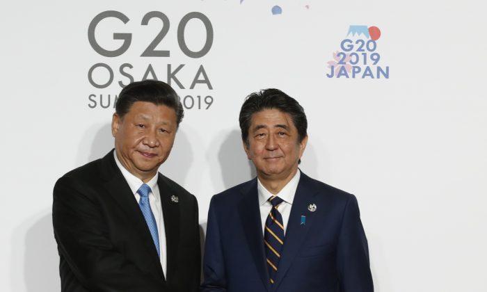 Xi Said He Wouldn’t Be Communist If Born in Japan: Shinzo Abe Memoir
