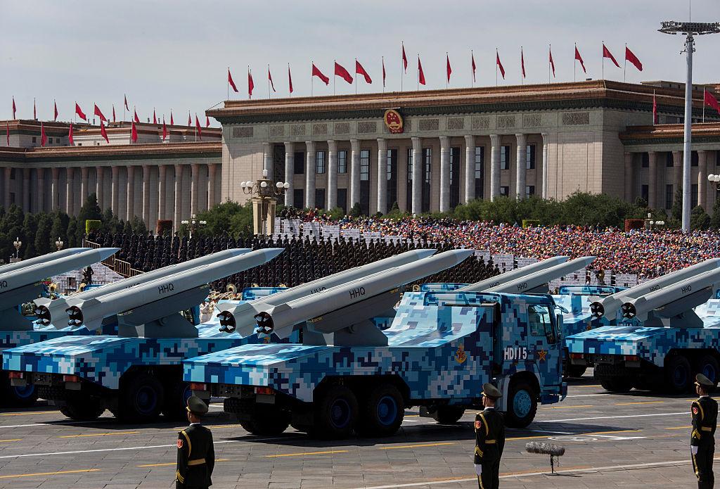 Chinese missiles are shown on trucks as they drive next to Tiananmen Square and the Great Hall of the People during a military parade in Beijing on Sept. 3, 2015. (Kevin Frayer/Getty Images)
