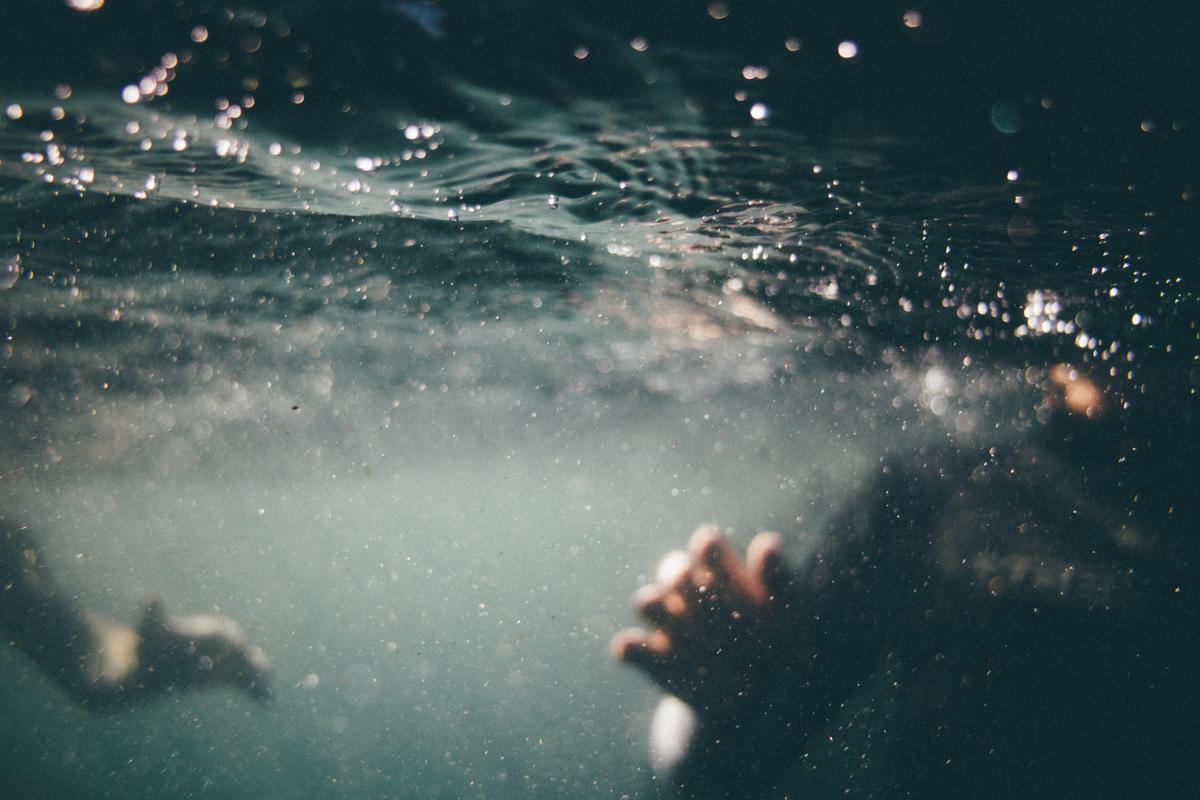 Stock photo of someone in water. (Tim Marshal/Unsplash)