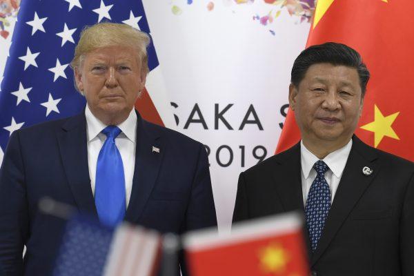 President Donald Trump (L) poses for a photo with Chinese leader Xi Jinping during a meeting on the sidelines of the G-20 summit in Osaka, Japan on June 29, 2019. (AP Photo/Susan Walsh)
