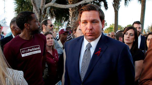 Florida Republican Gov. Ron DeSantis (R) arrives at a memorial service on the one-year anniversary of the shooting that claimed 17 lives at Marjory Stoneman Douglas High School in Parkland, Fla., on Feb. 14, 2019. (Joe Skipper/File Photo/Reuters)